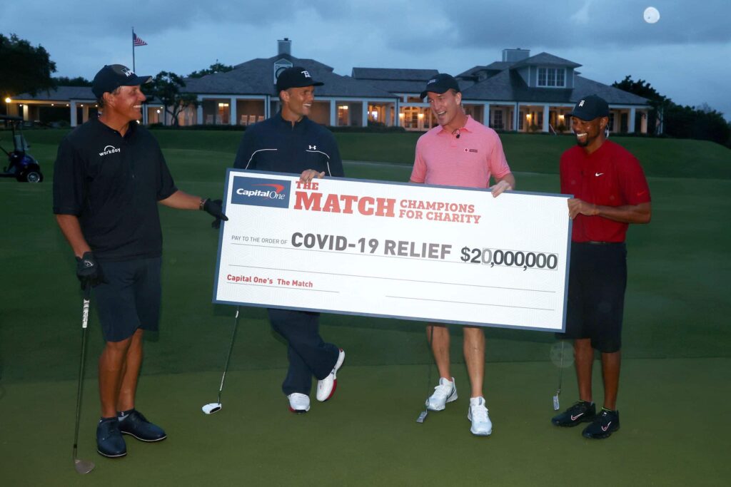 Woods wins charity golf match wit Tom Brady